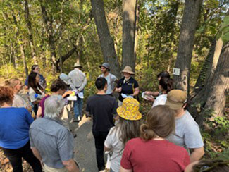 Dr. Reall leading a lesson on tree identification with a Master Naturalist group (2024).