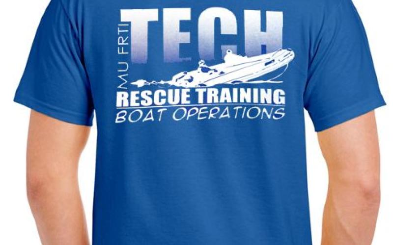 Photo of blue shirt back with boat rescue design