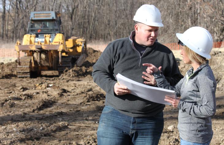 Rodriguez, right, consults with her company’s chief engineer, Matt Thomas, on the East Locust Creek Reservoir site cleanup project.Photo by Phil Leslie