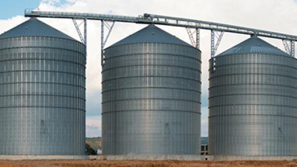 Grain elevators in a field