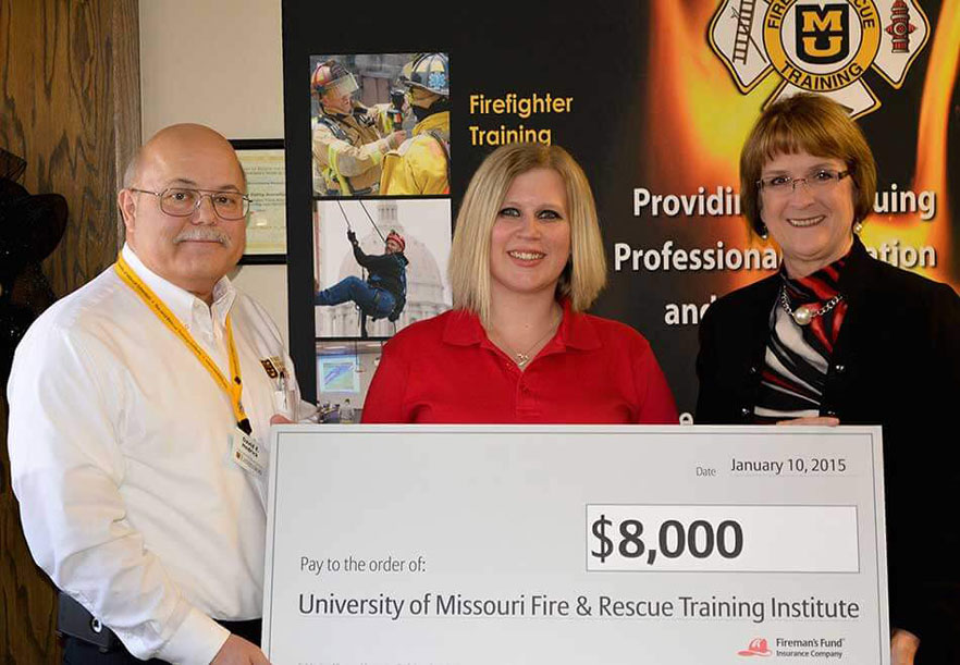 Reps from Fireman's Fun present grant to FRTI