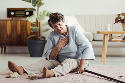 Senior woman sitting on floor after a fall.