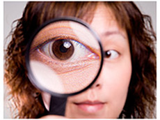 Woman with her eye magnified