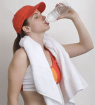 Female athlete drinking water