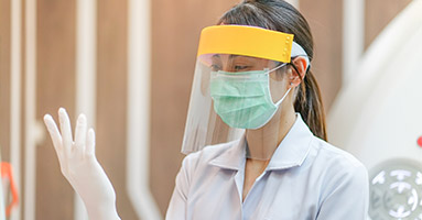 Health care provider wearing personal protective equipment
