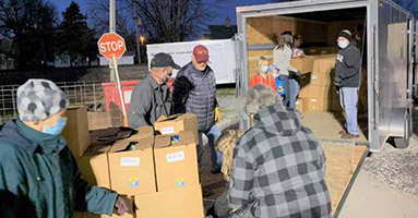 Monroe County community members distributing food boxes