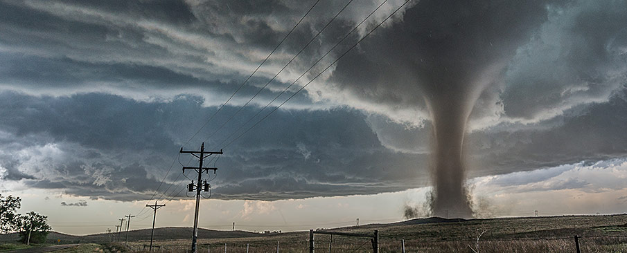 A tornado on rural farmland.