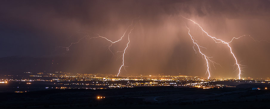 Lightning over a city at night.