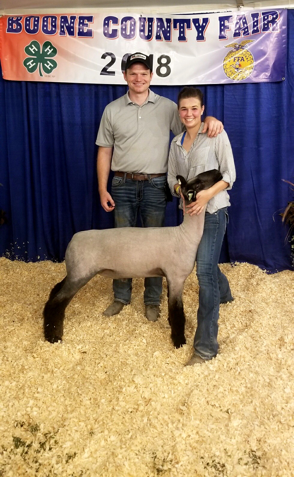 Kassie Rankin, right, with Will Garrett, an agent for Missouri Farm Bureau Insurance and an owner of Garrett Club Lambs. Both businesses donated to the scholarship fund.