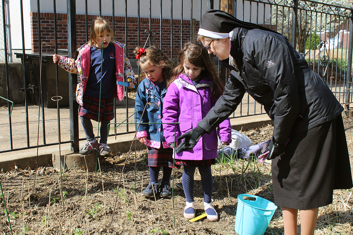 Open Students at Sacred Heart Villa Preschool learn gardening skills as part of the school’s Outdoor Classroom program. They grow fruits and vegetables for their school lunches in 23 berms in the schoolyard. Photo by Linda Geist.