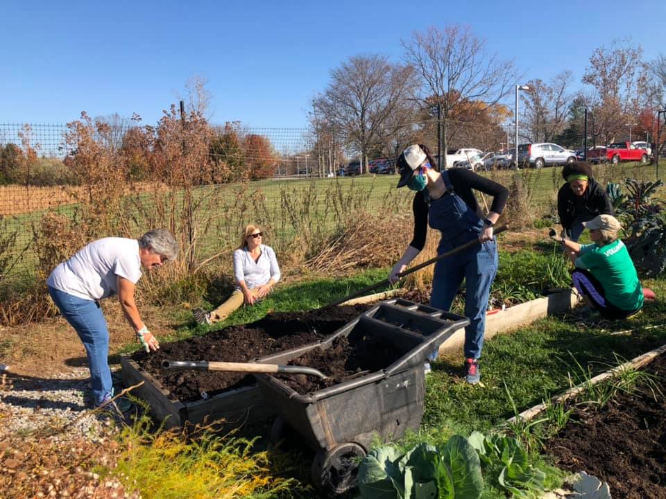 Master Gardeners work with community volunteers to prepare the gardens for plantings.
