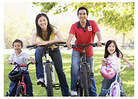 Family of four on bikes