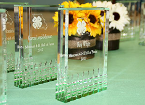 Missouri 4-H Hall of Fame awards on a table.