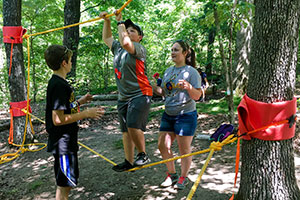 4-H campers participate in an obstacle course at Camp Clover Point. 