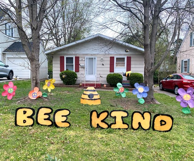 Open This LAWN art conveys a simple message about being kind to neighbors with a fun play on words.