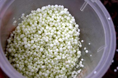 Urea treated with NBPT stabilizer additive indicated by green color