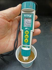 Portable pH meter used to test acid in soil