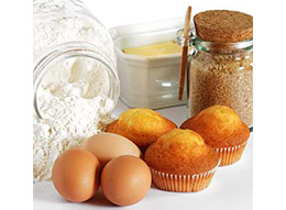 Ingredients for homemade muffins including flour, sugar, butter and eggs