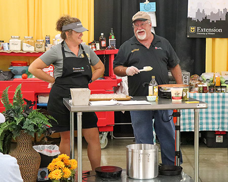 Tracy Minnis and Larry Roberts doing live cooking demonstration at State Fair