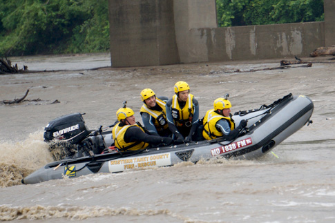 firefighters training in a boat
