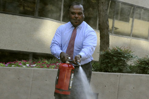 Man with fire extinguisher