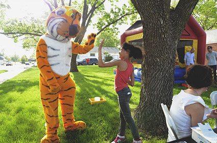 Truman giving high-five to girl at MU FIC event