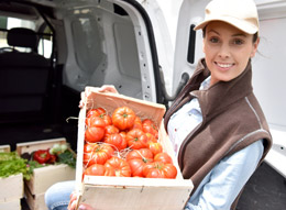 Woman delivering tomatoes