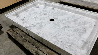 A marble looking shower base manufactured by Prock Operations.