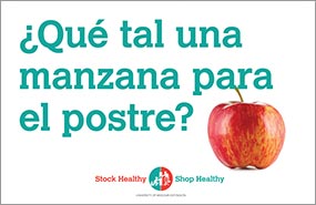 Sign with red apple that reads "Qué tal una manzana para el postre (how about an apple for dessert)?"