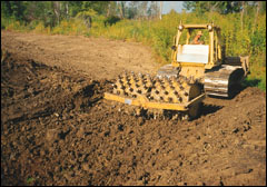 A sheepsfoot roller provides the high degree of compaction often necessary to seal permeable soils at a pond site.