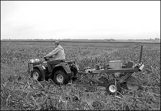 An all-terrain vehicle with a one-row, no-till planter.