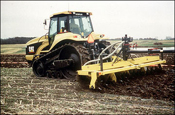 Liquid manure being pumped from a manure storage facility and applied by rotating tines.