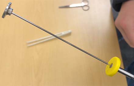 An artificial insemination catheter plunger pulled back in preparation for loading.