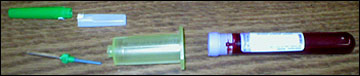 Double-ended needle and blood collection tube used