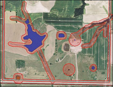 Aerial photograph of a farm with setbacks around sensitive areas shown in red