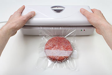 Vacuum packing a frozen hamburger at home
