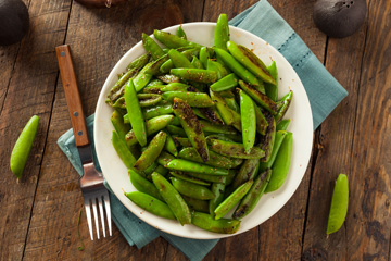 bowl of sautéed sugar snap peas