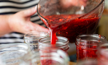 jam being poured into jars