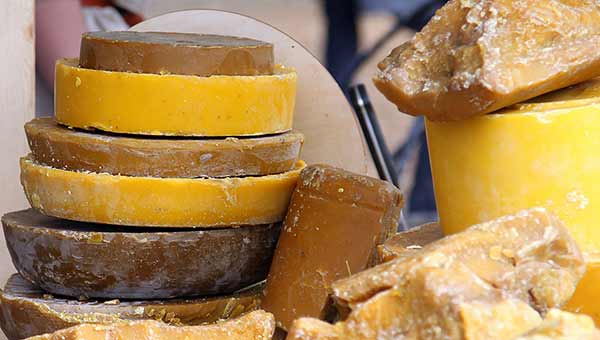 Stack of yellow and brown pieces of beeswax