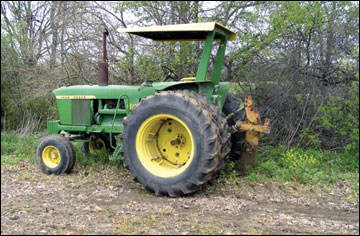 Root plowing the edge of the soybean field 