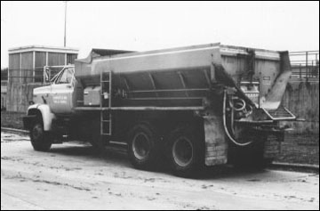 Dry biosolids are applied with mechanical spreading equipment