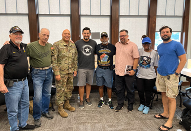 Josh Shinn (center) with participants in the Veteran R.E.A.D.S program (2024)