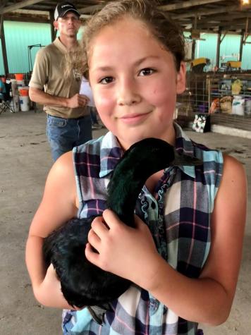 Audrey Tinoco poses with her prize-winning duck, Big Money.