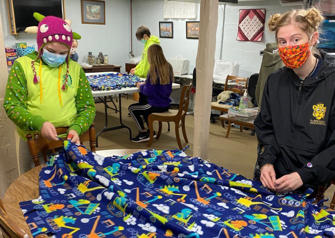 St. Charles County 4-H'ers Audrey Coletti, left, and Anna Bello. Club members and volunteers made 16 blankets for Project Linus.