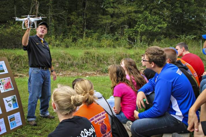 Kent Shannon shares information about agricultural technology with people of all ages. Photo taken pre-COVID.