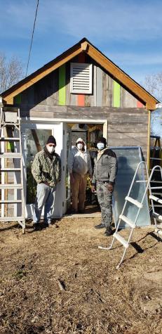 Friends of the Market Community Garden renovate space for indoor gardens and storage.