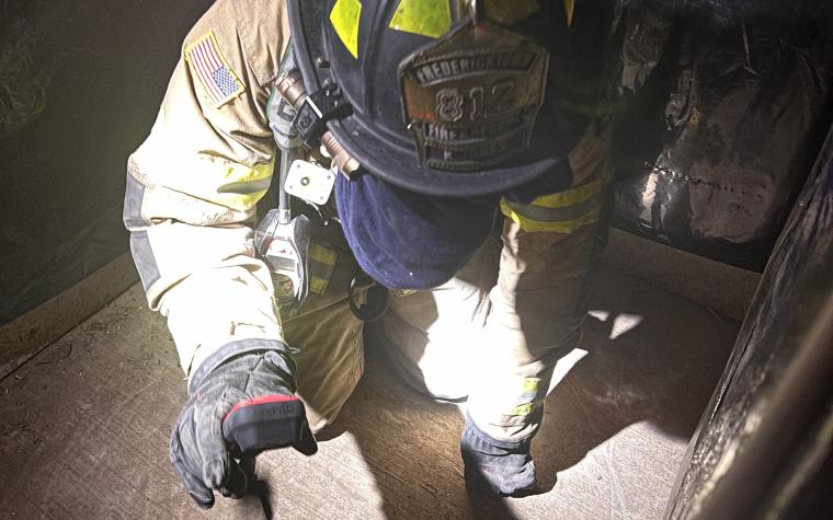 Firefighter with thermal imaging camera