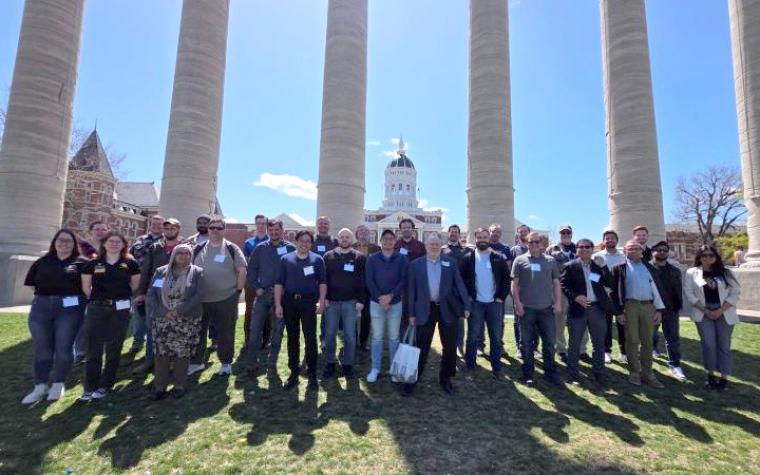Training program participants in front of the Mizzou columns.