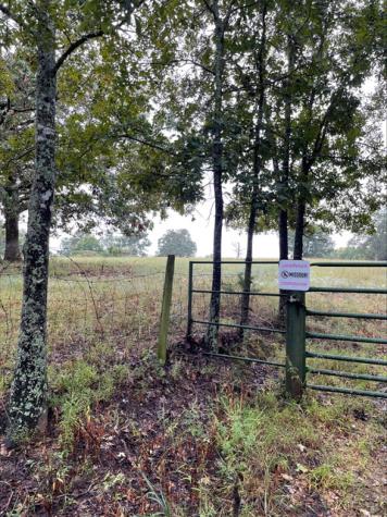 Outdoor sign noting landowner's participation in the Feral Hog Elimination Partnership