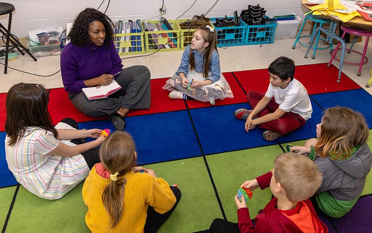 Teacher and children in a classroom